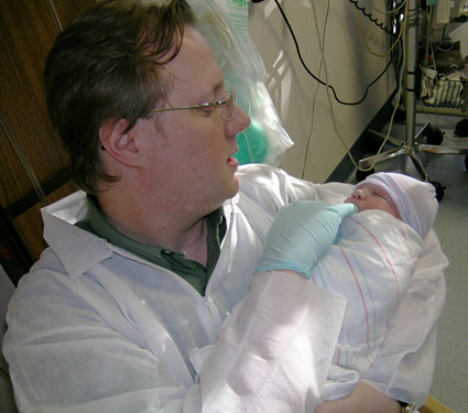 Beau holding baby James