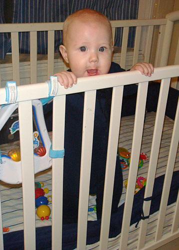 James, standing up in his work crib