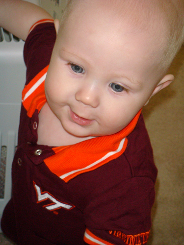 James wearing a Virginia Tech onesie